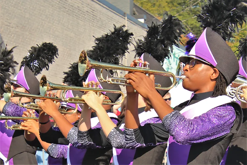 trumpet players in high school marching band